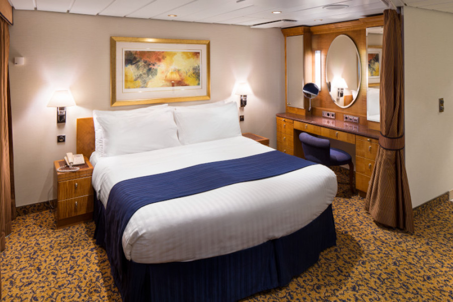 Спальня в каюте Grand Suite с 1й спальней на лайнерах класса Radiance Class